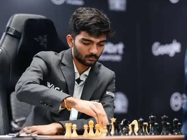 Indian Chess Grandmaster Gukesh Dommaraju playing a strategic chess match.